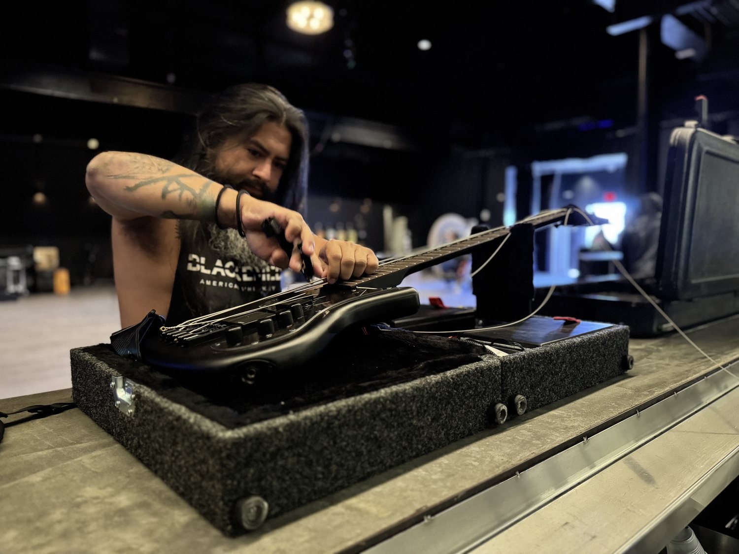 Working on a guitar at the bench